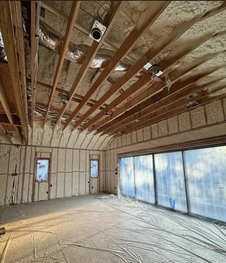 Interior walls and ceiling insulated with spray foam during new construction in Ottumwa